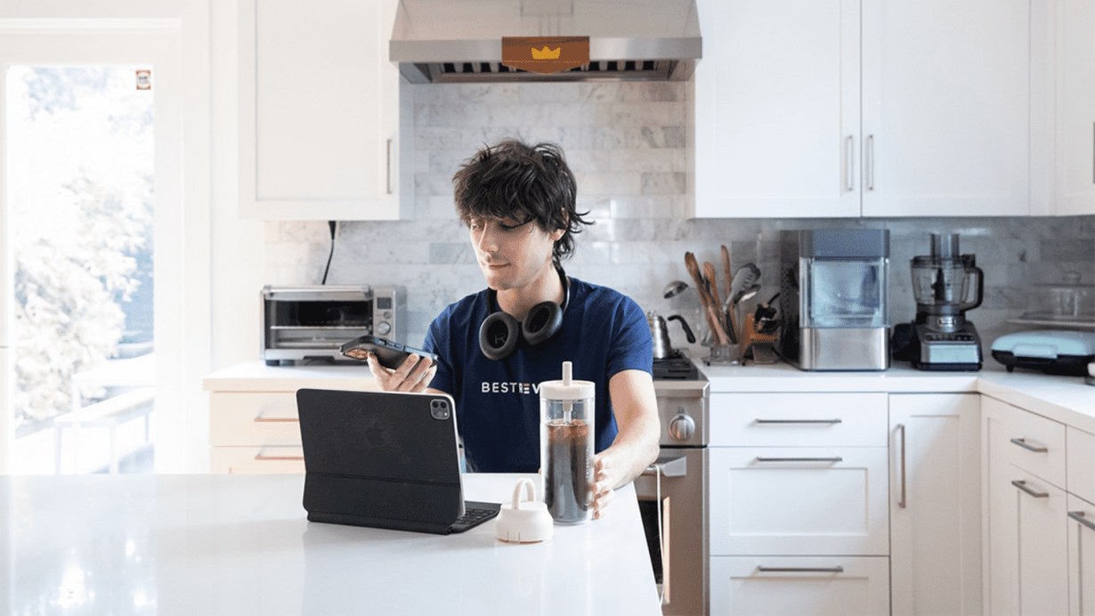 Drinking coffee and using Apple Smart Keyboard in the kitchen Drinking coffee and using Apple Smart Keyboard in the kitchen