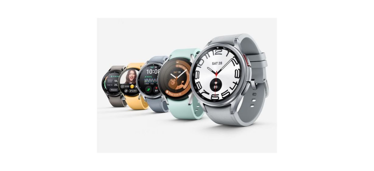 Five Galaxy Watch6 watches in dark gray, yellow, light grayish blue, light aqua and gray.
