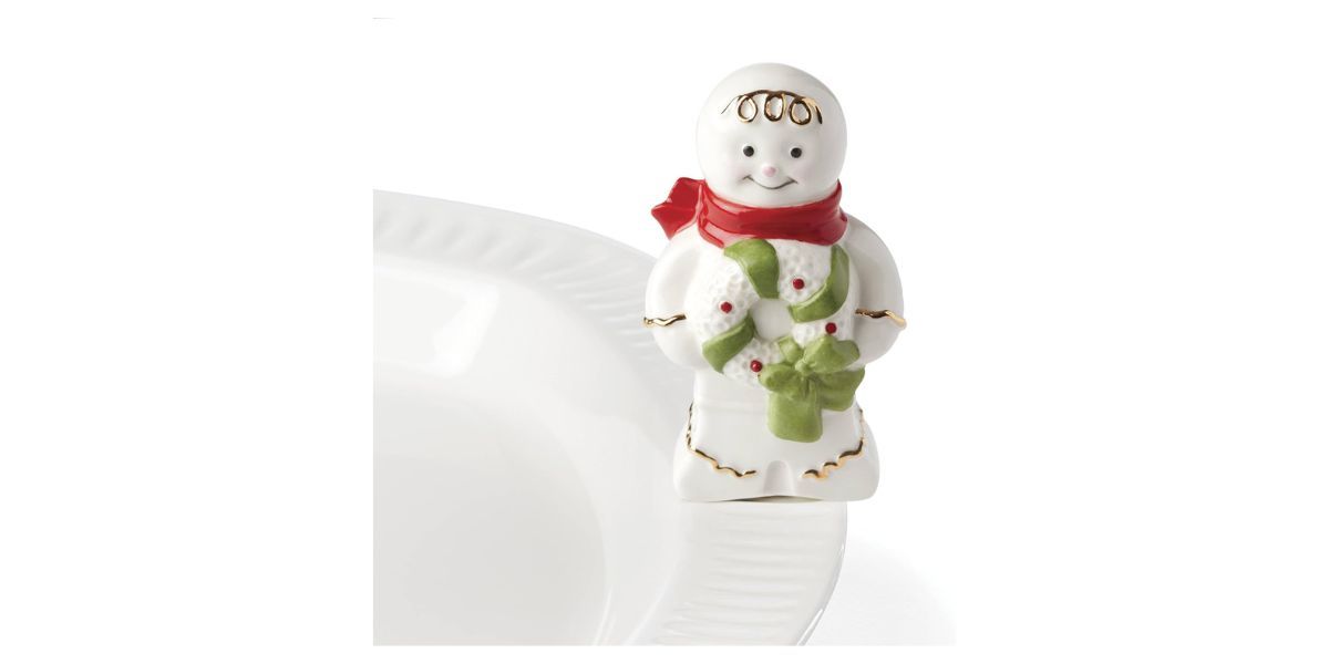 small ceramic gingerbread figure on white background small ceramic gingerbread figure on white background
