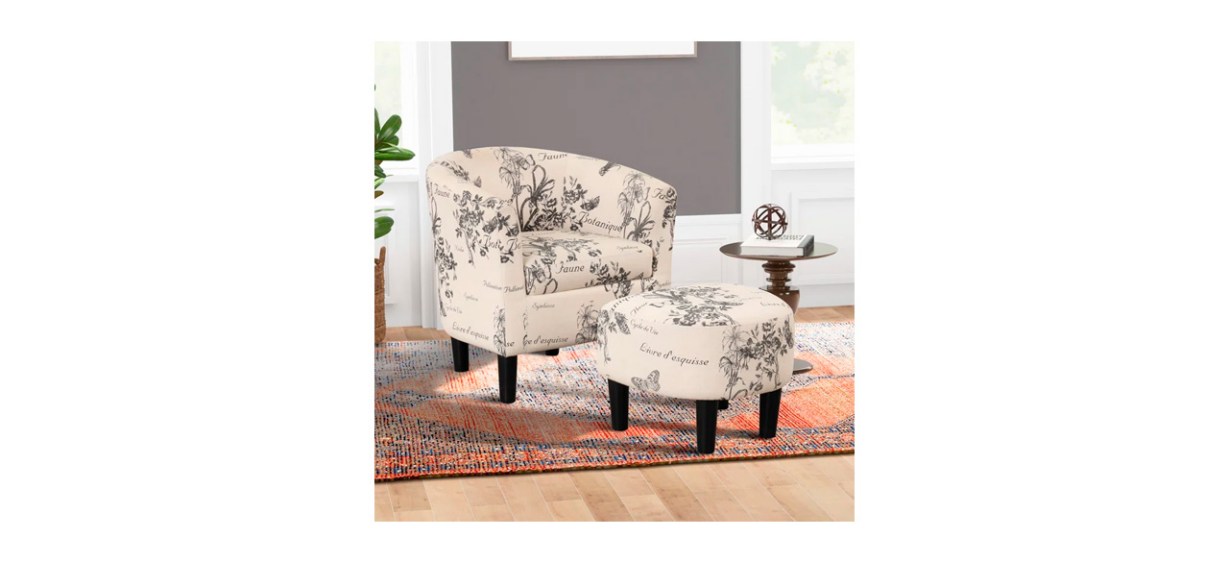 Ophelia &amp; Co. Pamplona 26-Inch Upholstered Barrel Chair and Ottoman in beige with black floral designs and French words on them