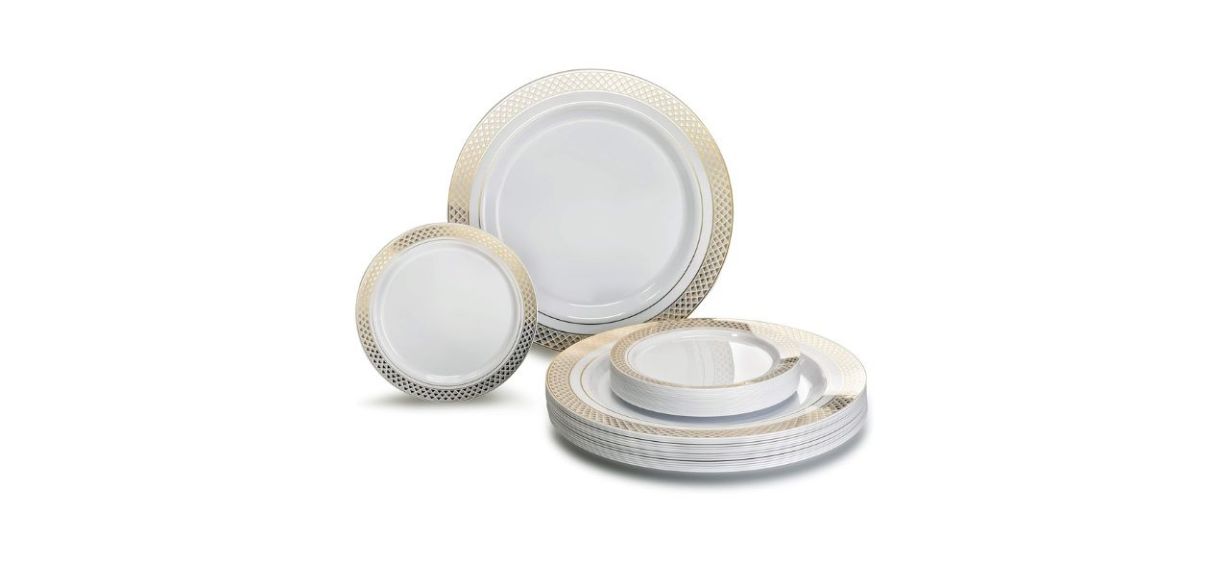 A set of white plastic plates with gold borders