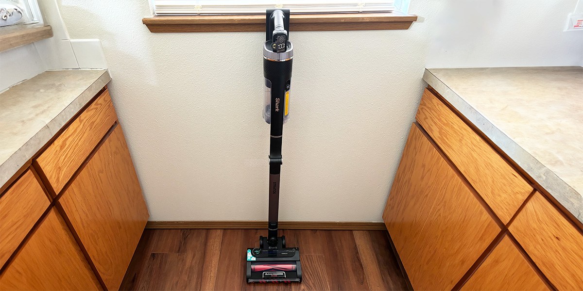 Shark Vertex Ultra Lightweight Cordless leaning against wall in kitchen